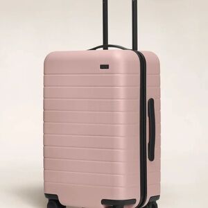 Away Bigger Carry-on Luggage Suitcase in Blush Pink with accessories